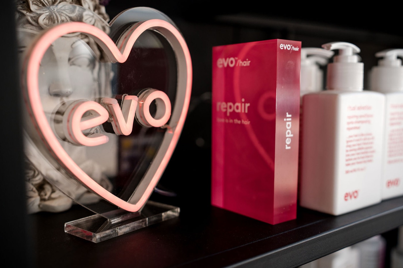 The evo shelf and neon heart at the front counter