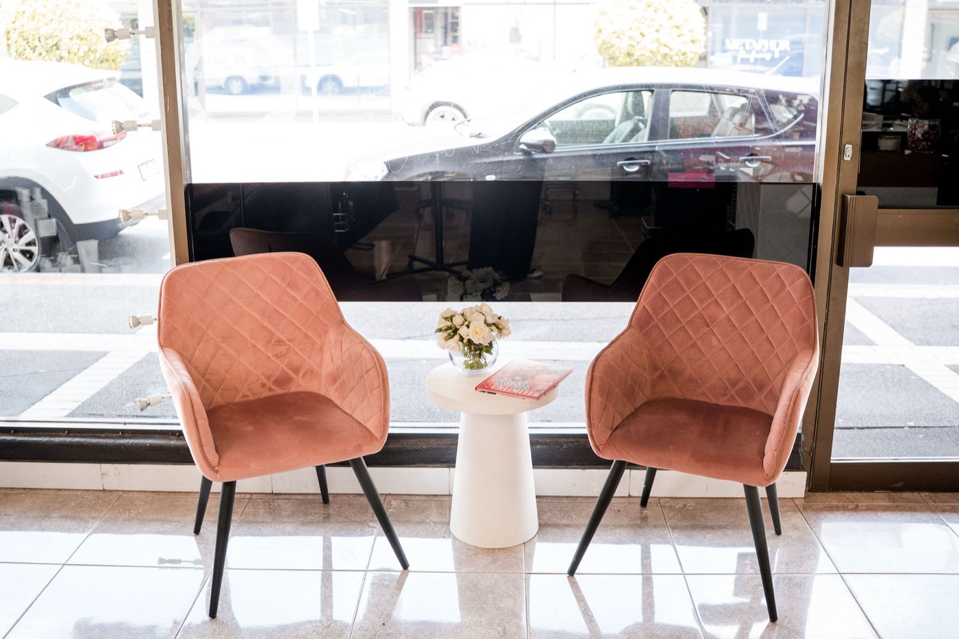 The two velvet chairs in Synergy's front window on Centre Road